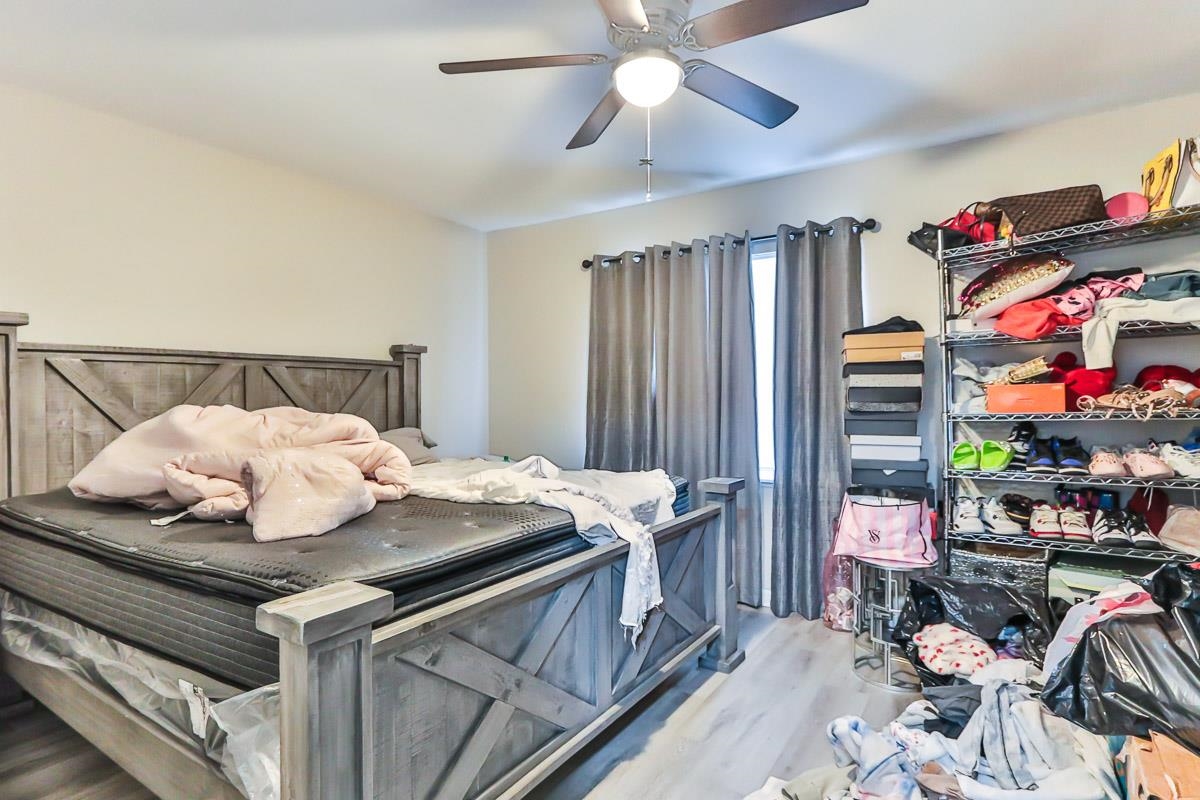 205 Plantation Road Myrtle Beach, SC 29588 - Photo 22 of 35 Bedroom with ceiling fan and light hardwood / wood