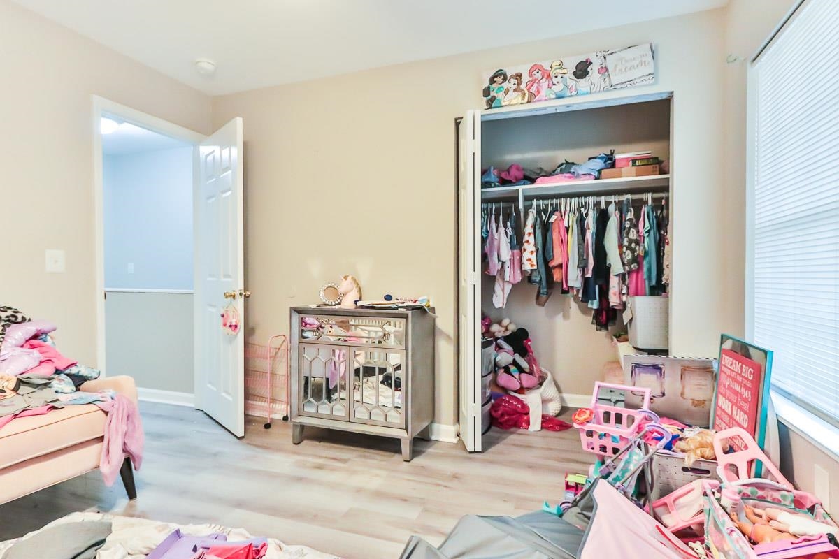 205 Plantation Road Myrtle Beach, SC 29588 - Photo 26 of 35 Bedroom featuring a nursery area, hardwood / wood-