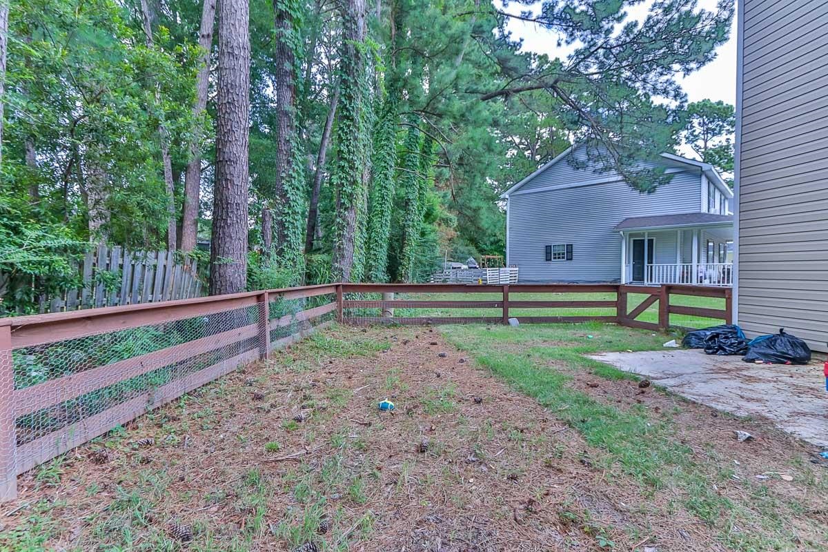 205 Plantation Road Myrtle Beach, SC 29588 - Photo 28 of 35 View of yard with covered porch