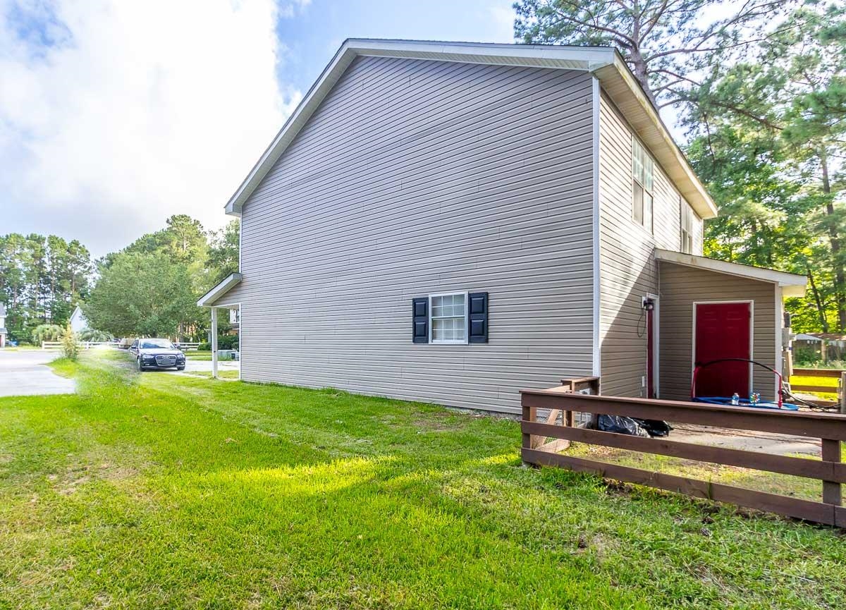 205 Plantation Road Myrtle Beach, SC 29588 - Photo 30 of 35 View of side of home featuring a lawn
