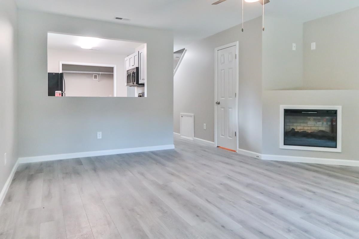 205 Plantation Road Myrtle Beach, SC 29588 - Photo 3 of 35 Unfurnished living room featuring light hardwood /