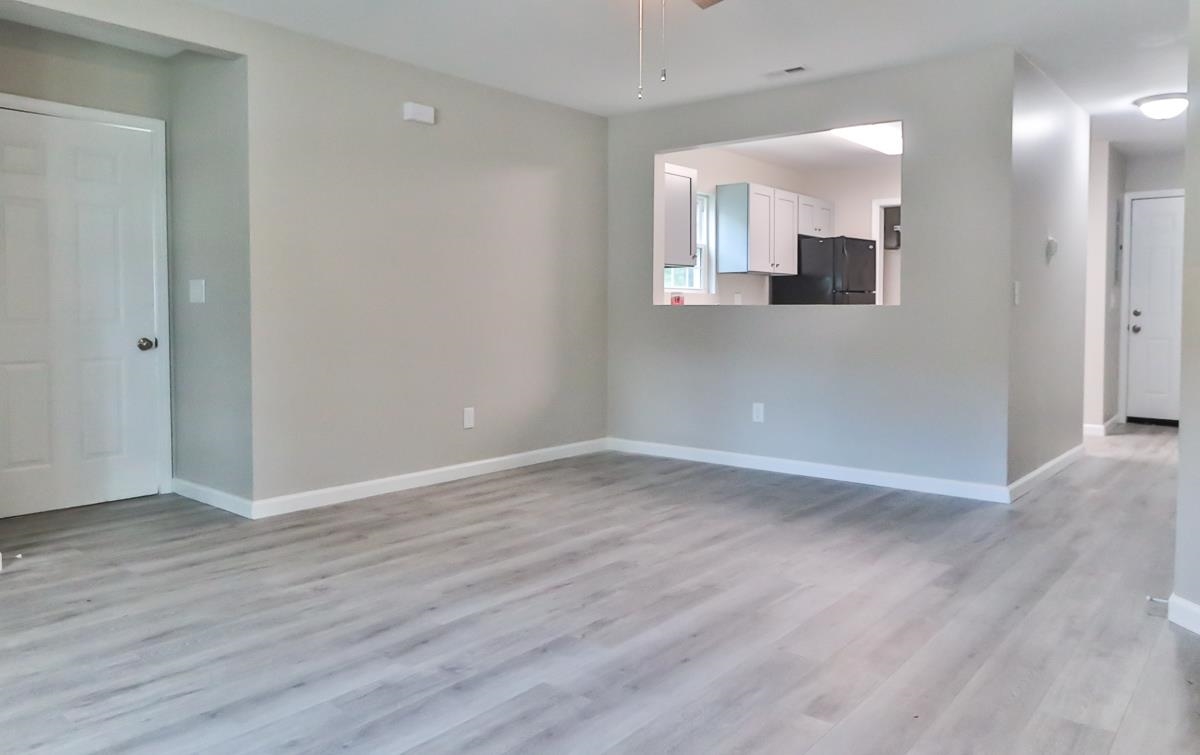 205 Plantation Road Myrtle Beach, SC 29588 - Photo 4 of 35 Unfurnished room with light wood-type flooring