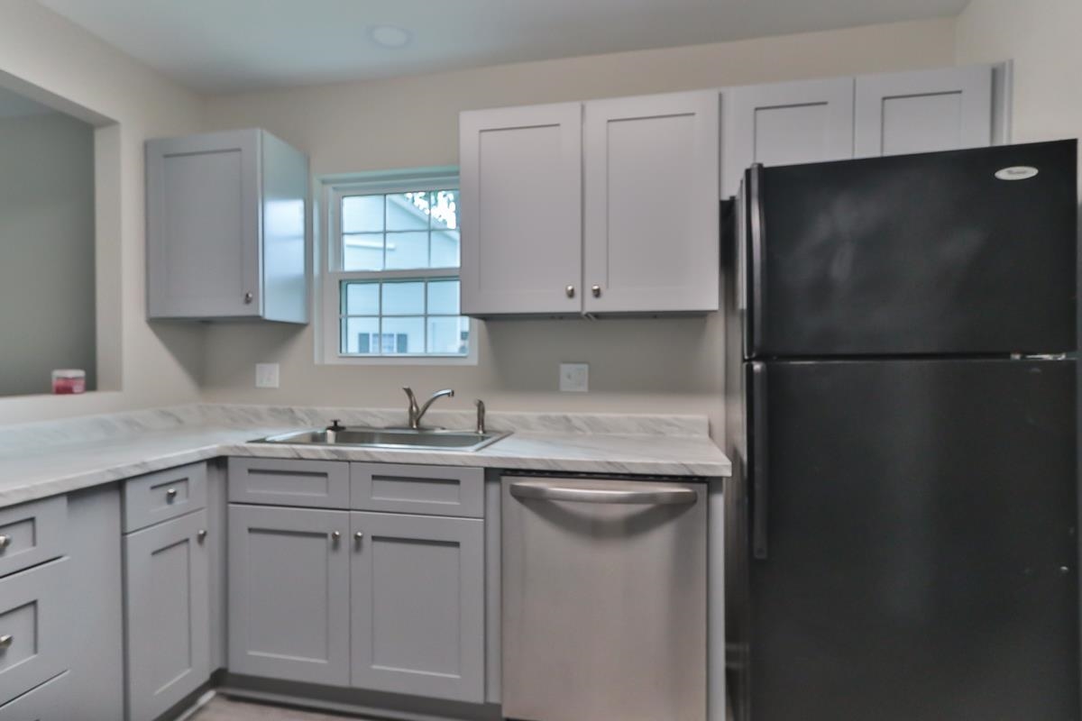 205 Plantation Road Myrtle Beach, SC 29588 - Photo 7 of 35 Kitchen with black refrigerator, sink, and stainle
