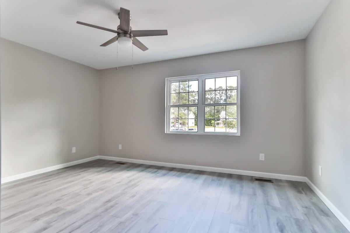 205 Plantation Road Myrtle Beach, SC 29588 - Photo 9 of 35 Spare room featuring ceiling fan and light hardwoo