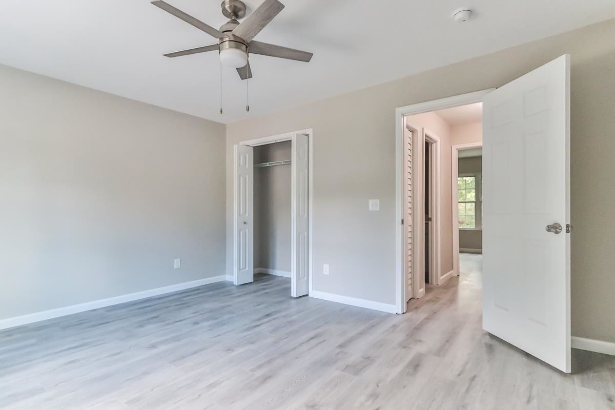 205 Plantation Road Myrtle Beach, SC 29588 - Photo 10 of 35 Unfurnished bedroom featuring a closet, light wood