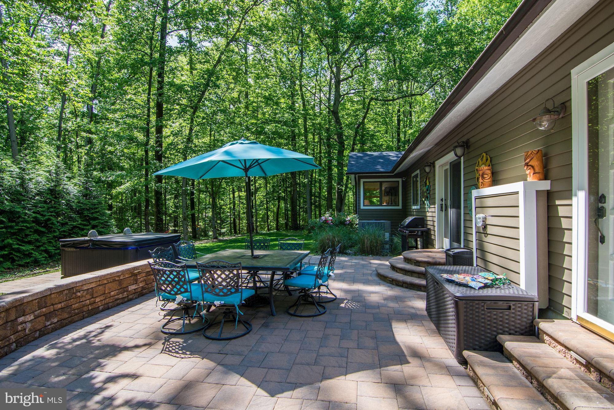 130 Claiborne Road Edgewater, MD 21037 - Photo 9 of 40 Patio w/ Stone Retaining Wall