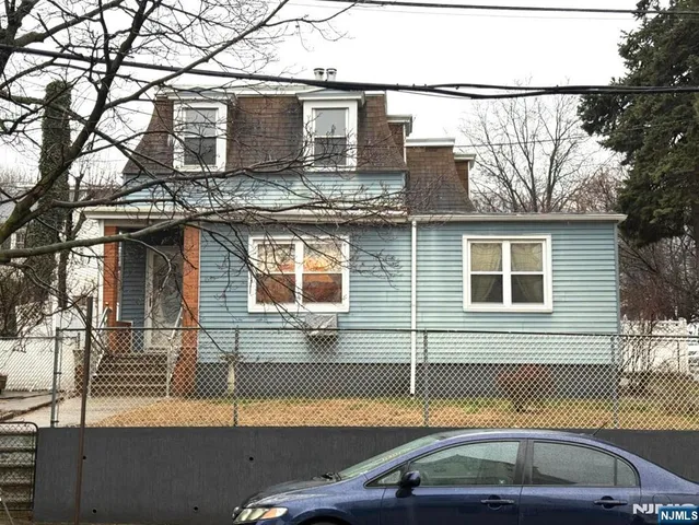 a front view of a house with parking