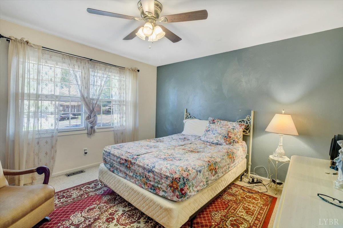 3101 Link Road, Unit 89 Lynchburg, VA 24503 - Photo 14 of 23 a bedroom with a bed and wooden floor