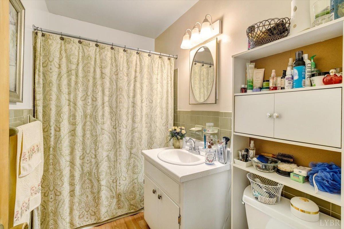 3101 Link Road, Unit 89 Lynchburg, VA 24503 - Photo 15 of 23 a bathroom with a sink vanity and a mirror