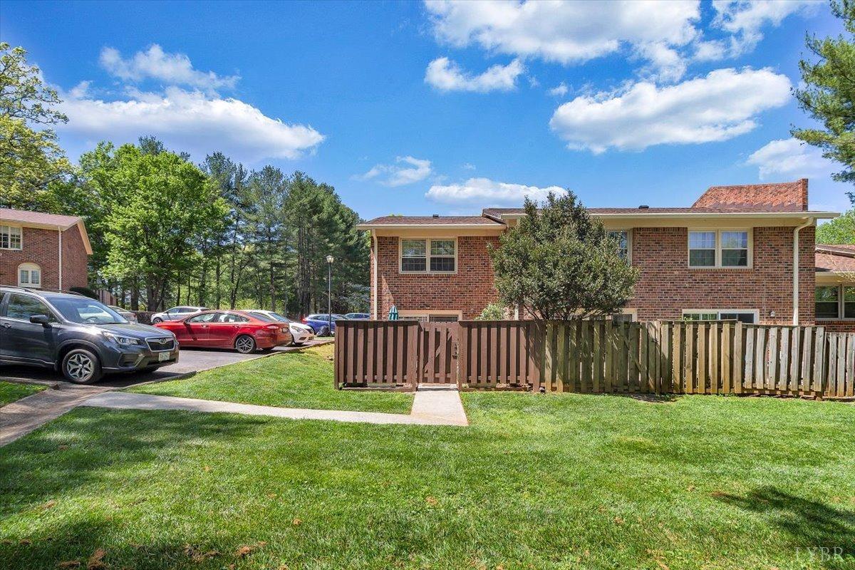 3101 Link Road, Unit 89 Lynchburg, VA 24503 - Photo 22 of 23 a view of a house with a yard and deck