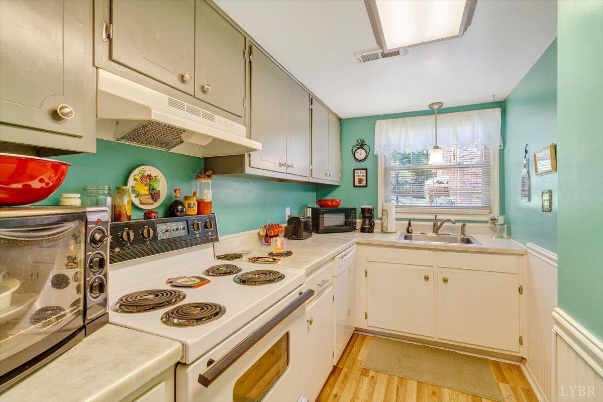 3101 Link Road, Unit 89 Lynchburg, VA 24503 - Photo 5 of 23 a kitchen with a sink a stove and cabinets