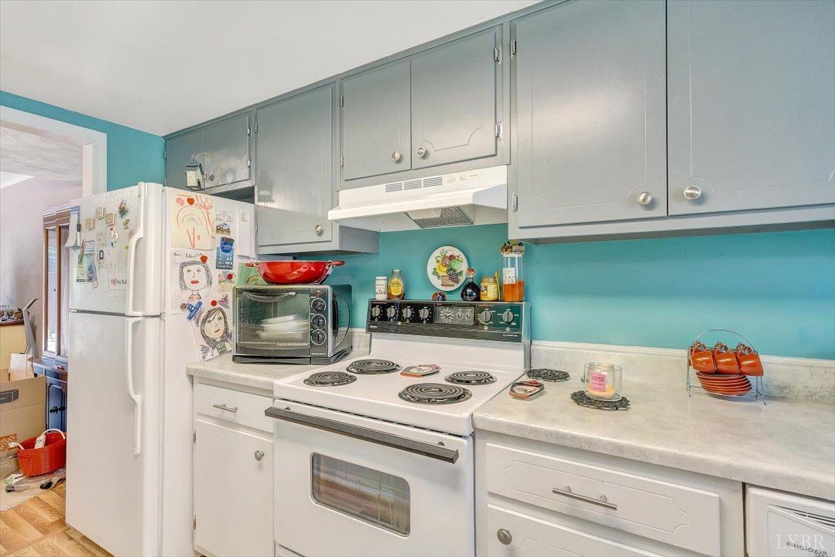 3101 Link Road, Unit 89 Lynchburg, VA 24503 - Photo 7 of 23 a kitchen with refrigerator and cabinets