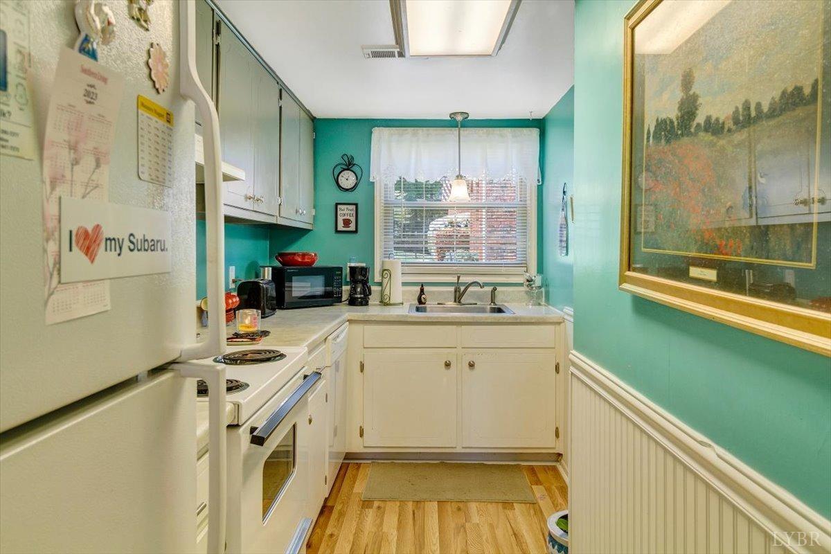 3101 Link Road, Unit 89 Lynchburg, VA 24503 - Photo 8 of 23 a kitchen with a refrigerator and a sink