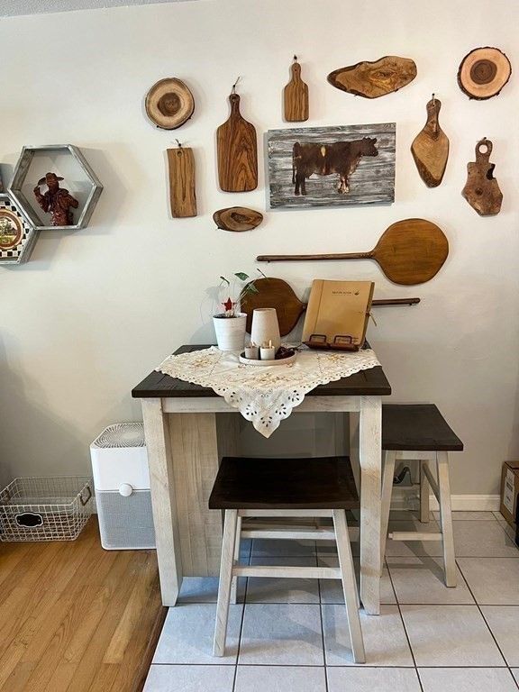 30 High Street, Unit 101 Dedham, MA 02026 - Photo 21 of 36 a view of table and chair