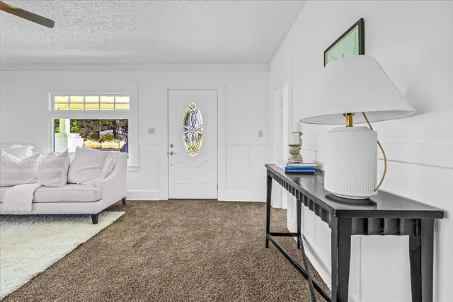 a view of a dining room with furniture window and outside view