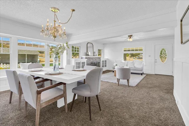a kitchen with granite countertop a sink cabinets and window