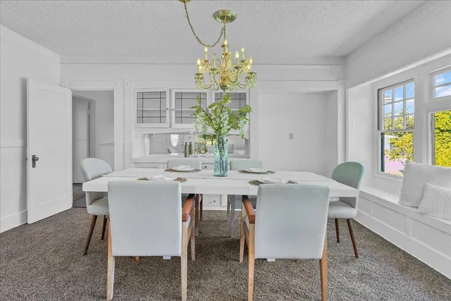 a view of kitchen with stainless steel appliances granite countertop cabinets and wooden floor