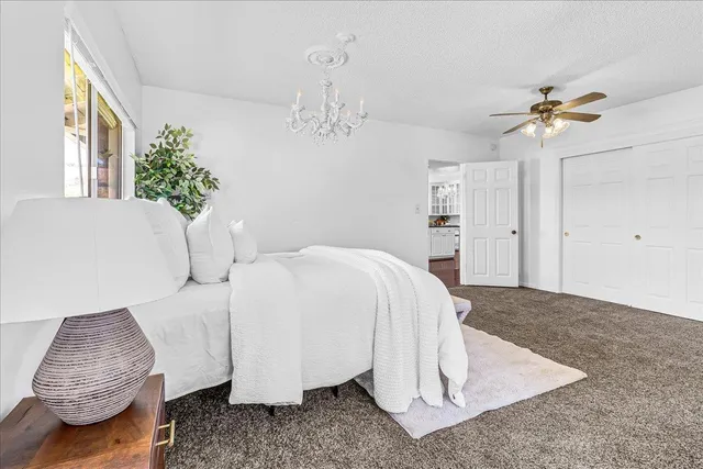 an empty room with windows and closet