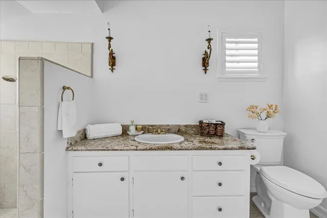 a bathroom with a sink and a window