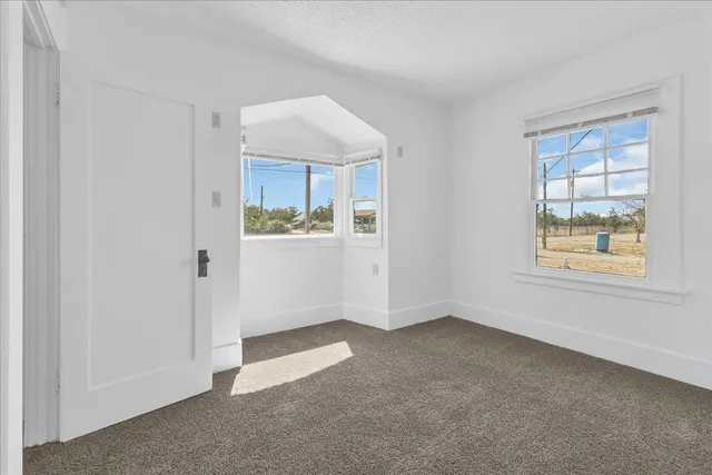 a view of an empty room and window