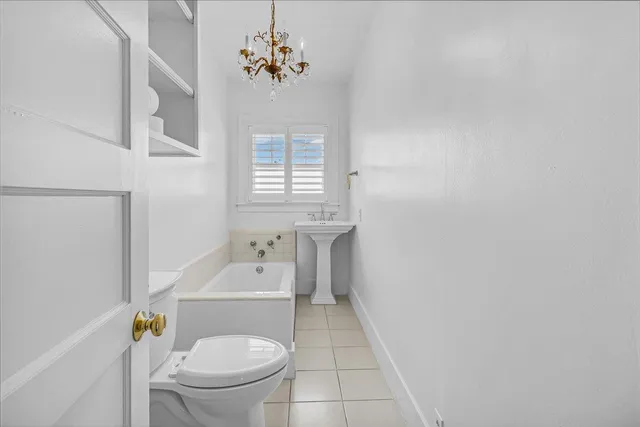 an empty room with windows and entrance