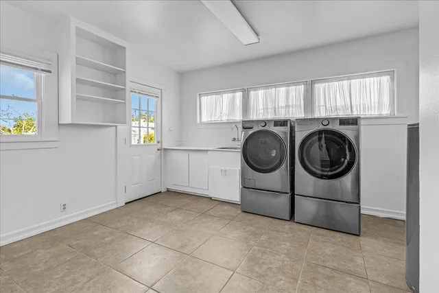 a kitchen with a table chairs and a refrigerator