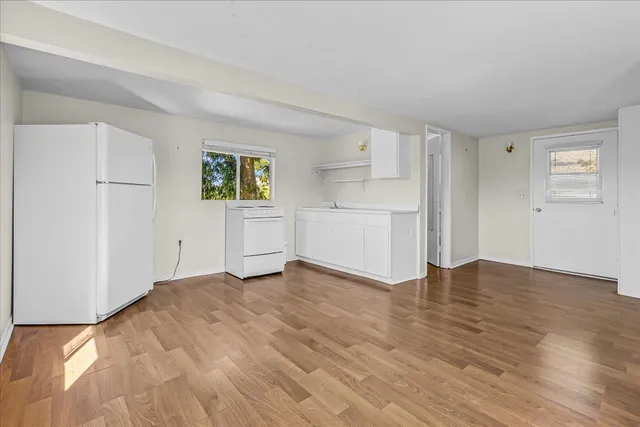 a view of a backyard with sitting area