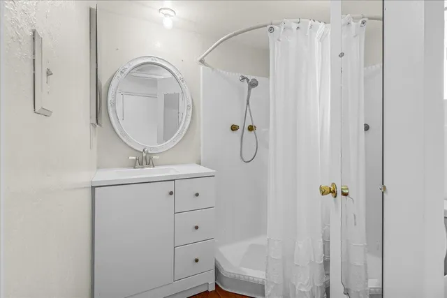 a view of a swimming pool with a patio and a garden