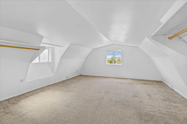 a view of a house with a swimming pool and a yard