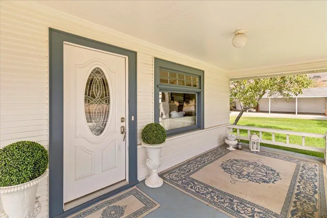 a living room with furniture and a table