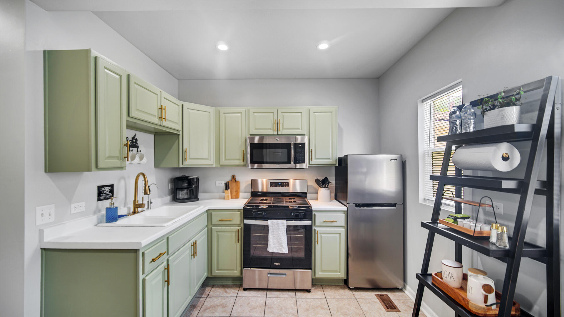 1422 Roberts Avenue Whiting, IN 46394 - Photo 25 of 29 a kitchen with stainless steel appliances granite countertop a refrigerator stove and sink