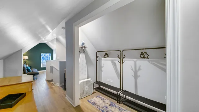 a view of living room with furniture and wooden floor