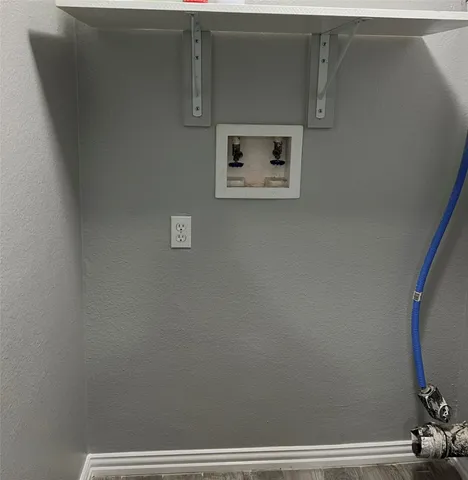 a view of room with hardwood floor and window