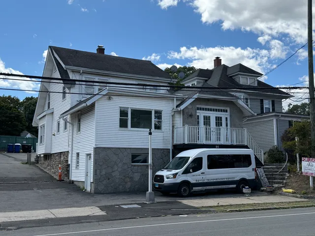 a car parked in front of a house