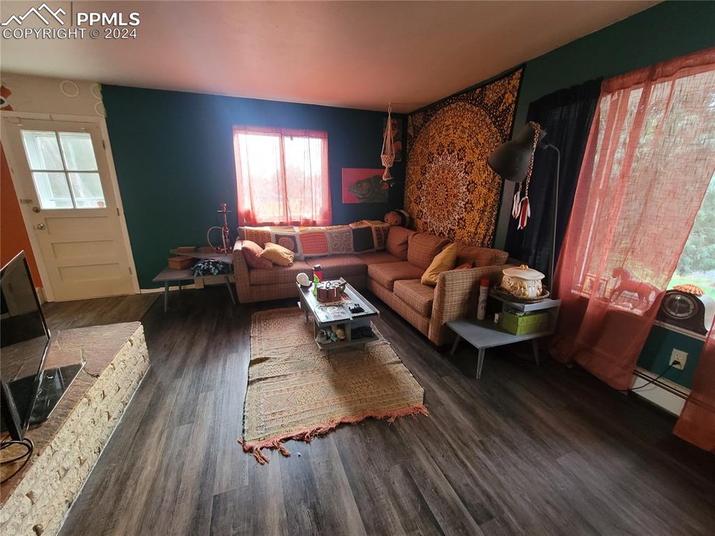 24401 Hillside Road Pueblo, CO 81006 - Photo 6 of 11 a living room with furniture and wooden floor