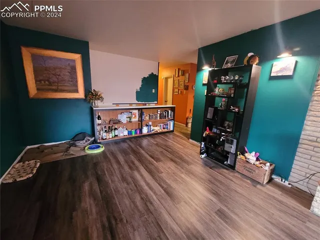 a bedroom with bunk bed and a wooden floor