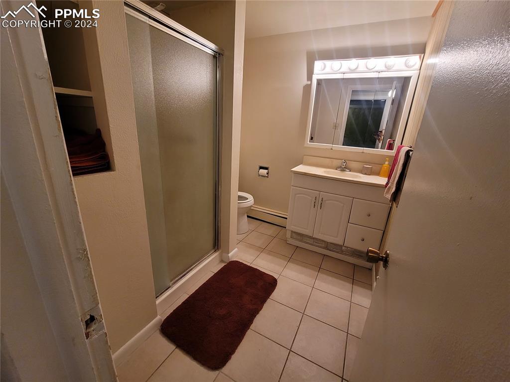 24401 Hillside Road Pueblo, CO 81006 - Photo 10 of 11 a view of a hallway and a livingroom with furniture
