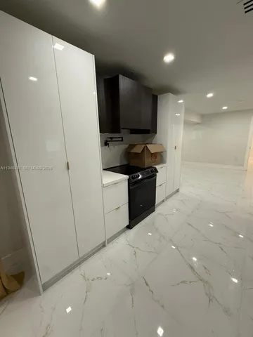 a bathroom with a shower a toilet and a sink