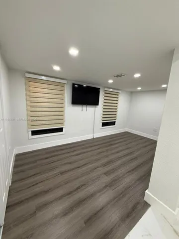 a bathroom with a shower and a toilet