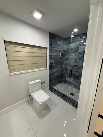 a view of a swimming pool with an outdoor space and seating area