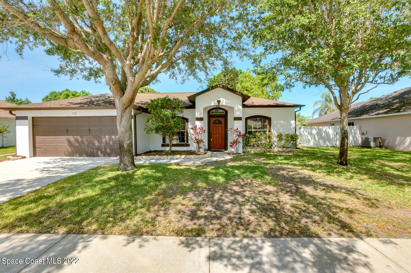 1936 Blue Ridge Avenue Melbourne, FL 32935 - Photo 1 of 35 a front view of a house with a yard