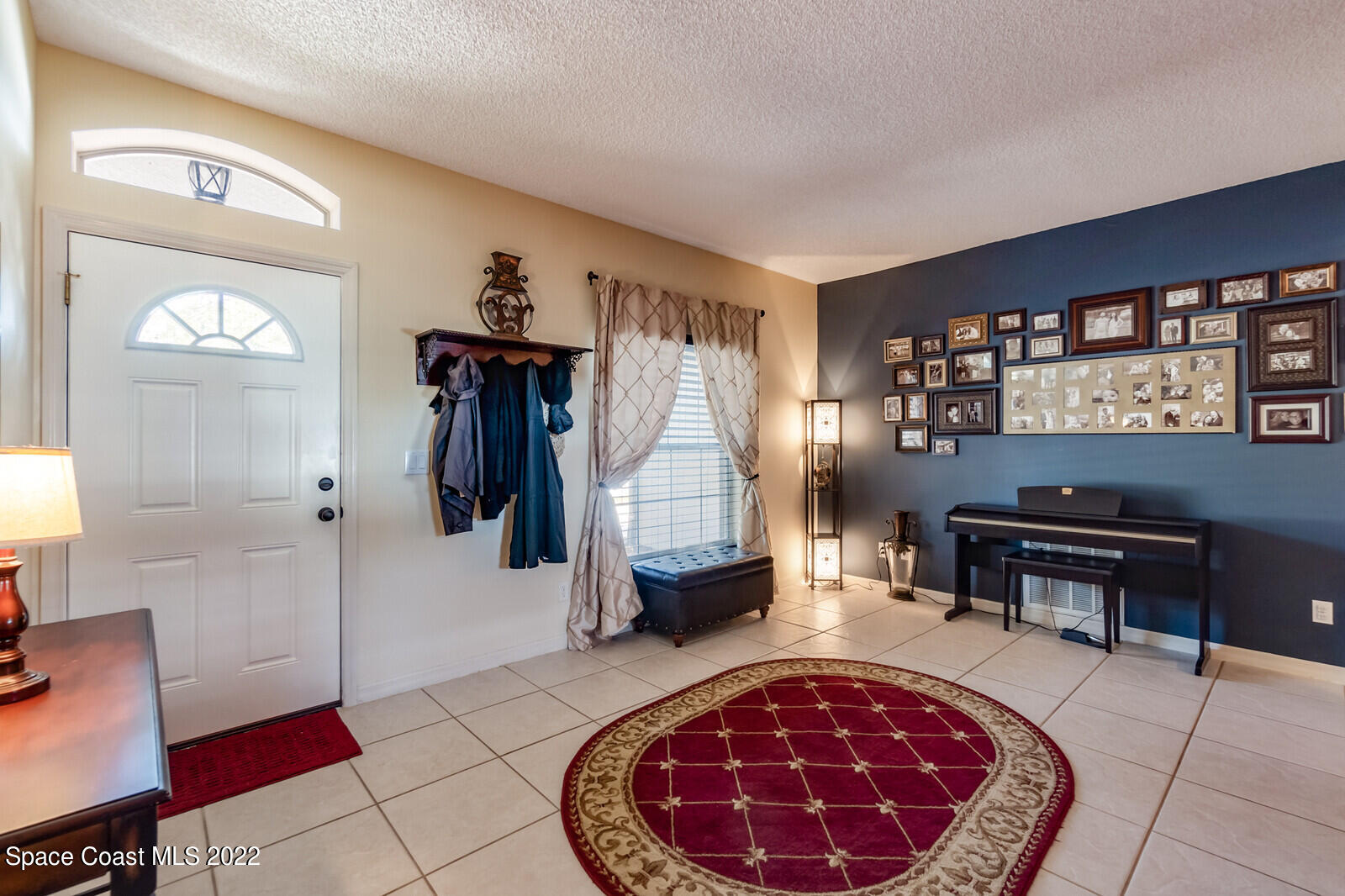 1936 Blue Ridge Avenue Melbourne, FL 32935 - Photo 12 of 35 a living room with furniture and a piano