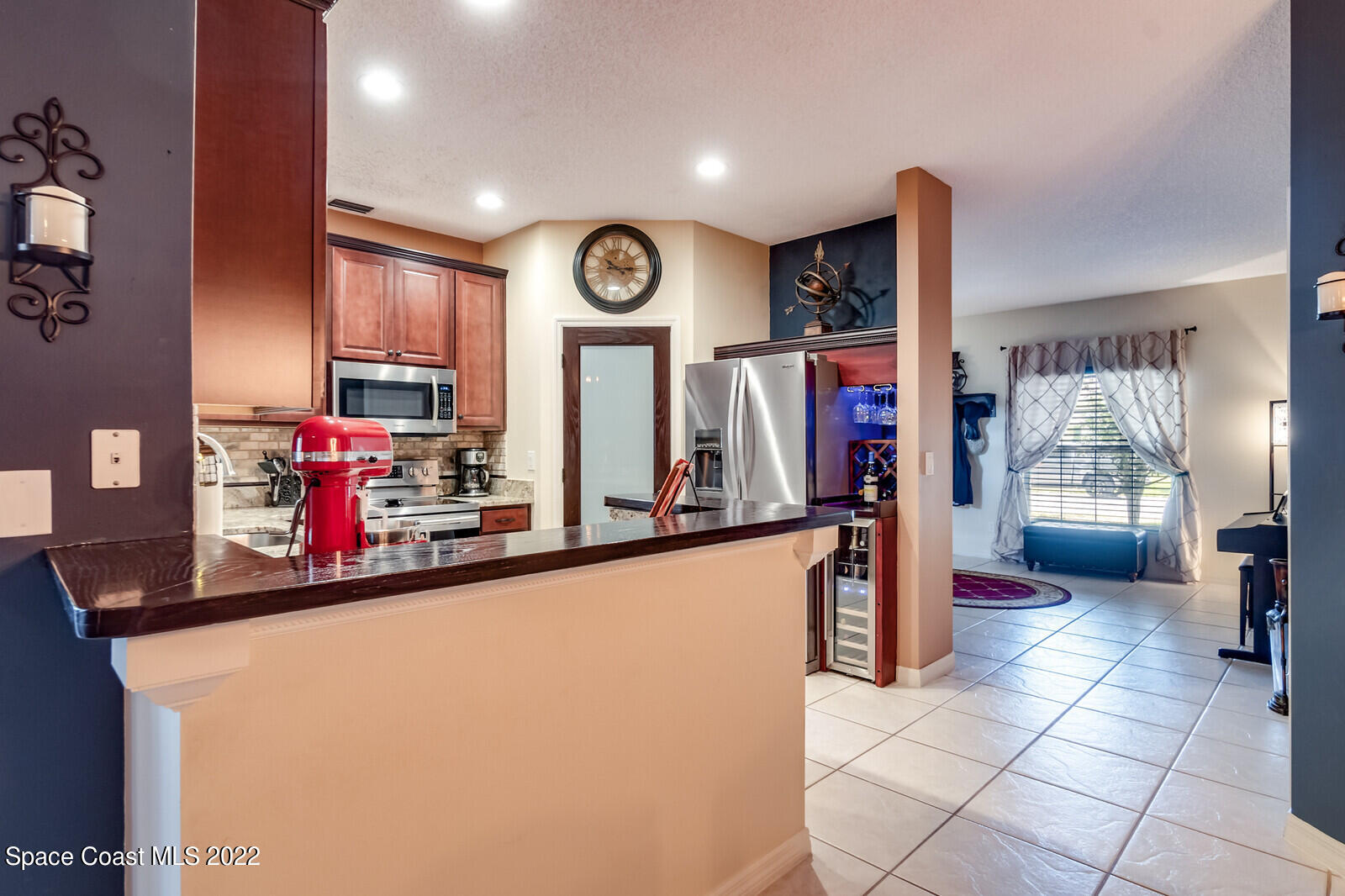 1936 Blue Ridge Avenue Melbourne, FL 32935 - Photo 18 of 35 a view of a kitchen with fridge and window