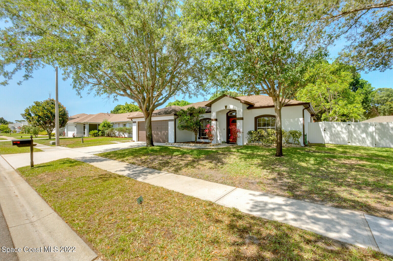 1936 Blue Ridge Avenue Melbourne, FL 32935 - Photo 2 of 35 a front view of a house with a yard