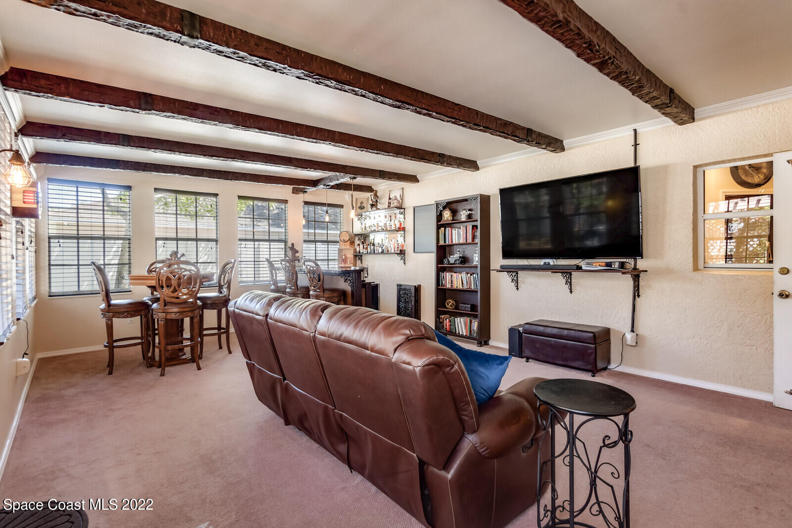 1936 Blue Ridge Avenue Melbourne, FL 32935 - Photo 23 of 35 a living room with furniture and a flat screen tv