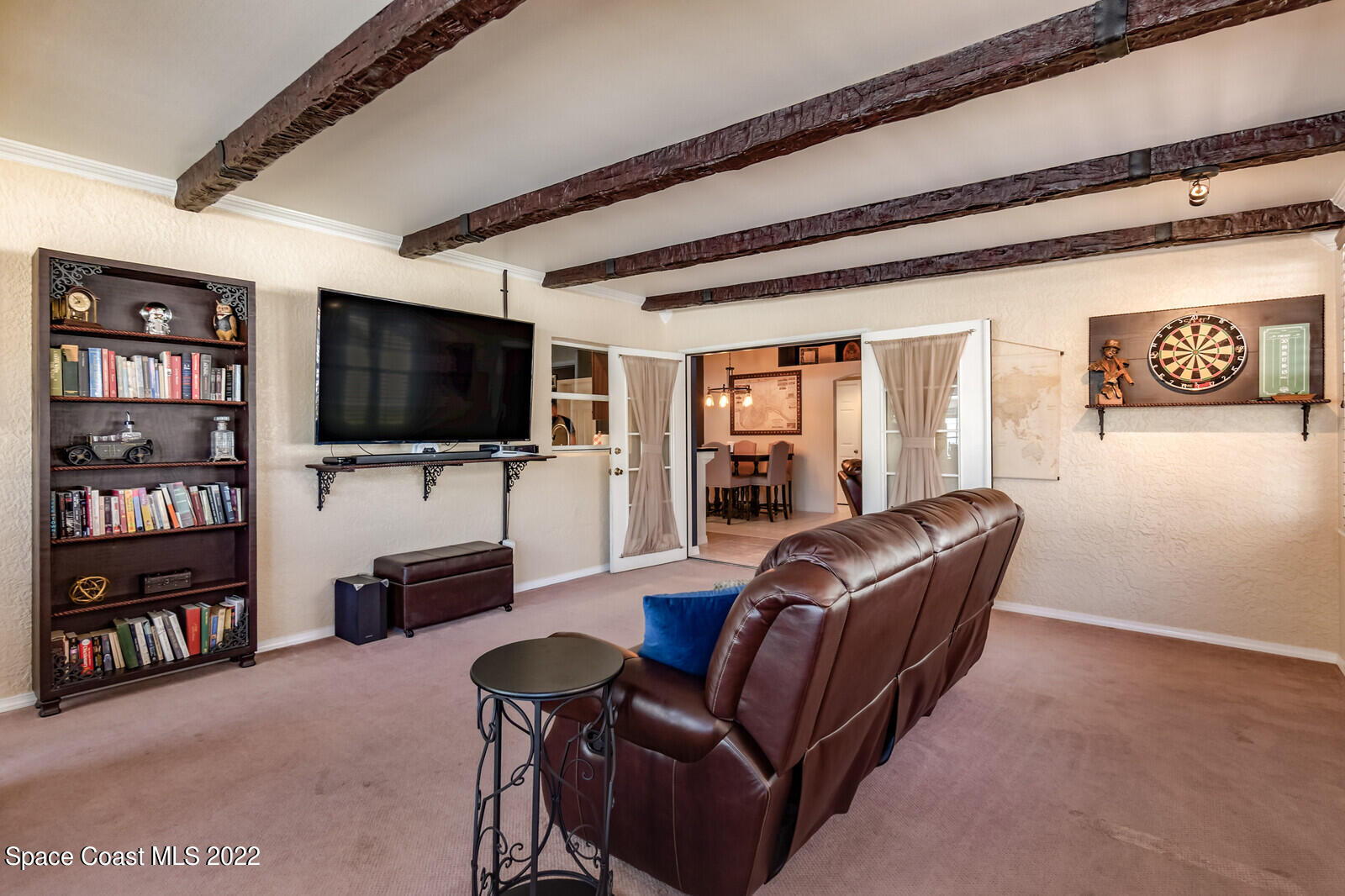 1936 Blue Ridge Avenue Melbourne, FL 32935 - Photo 24 of 35 a living room with furniture and a flat screen tv