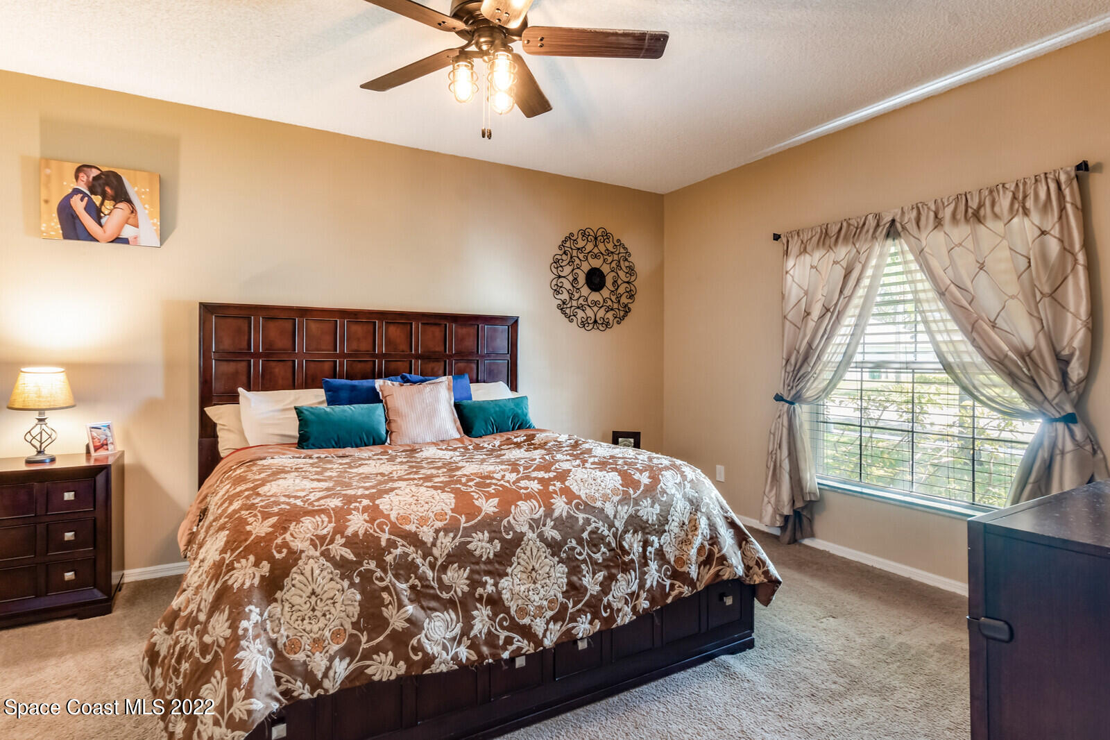 1936 Blue Ridge Avenue Melbourne, FL 32935 - Photo 28 of 35 a bedroom with a bed and a window