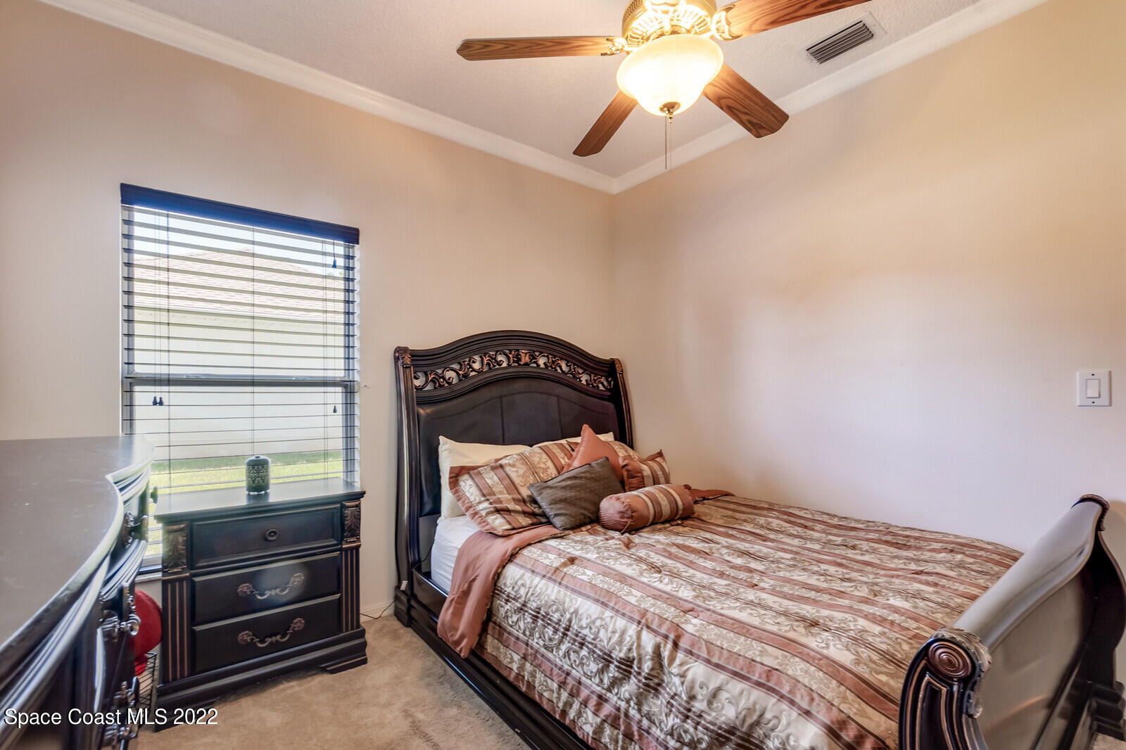 1936 Blue Ridge Avenue Melbourne, FL 32935 - Photo 32 of 35 a bedroom with a bed and a ceiling fan