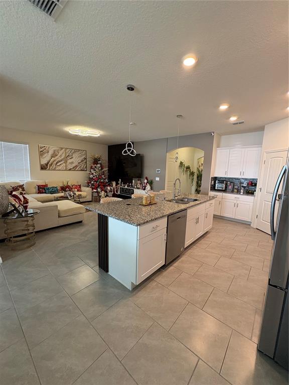 1948 Rankin Street Kissimmee, FL 34744 - Photo 13 of 37 a kitchen with a sink and cabinets