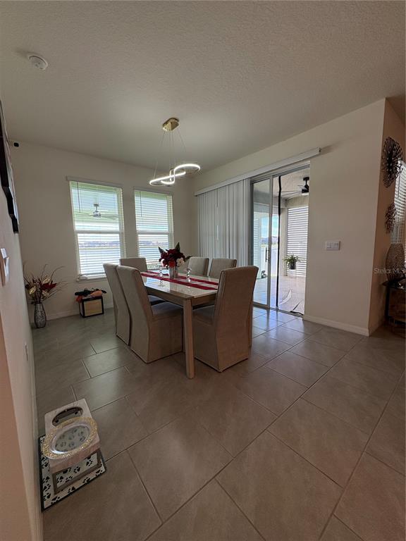 1948 Rankin Street Kissimmee, FL 34744 - Photo 18 of 37 a living room with couches and kitchen view with wooden floor